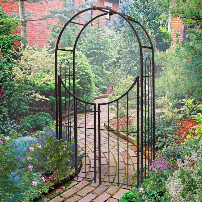 Secret Garden Arch & Gate in a beautifully landscaped garden with flowers and greenery.